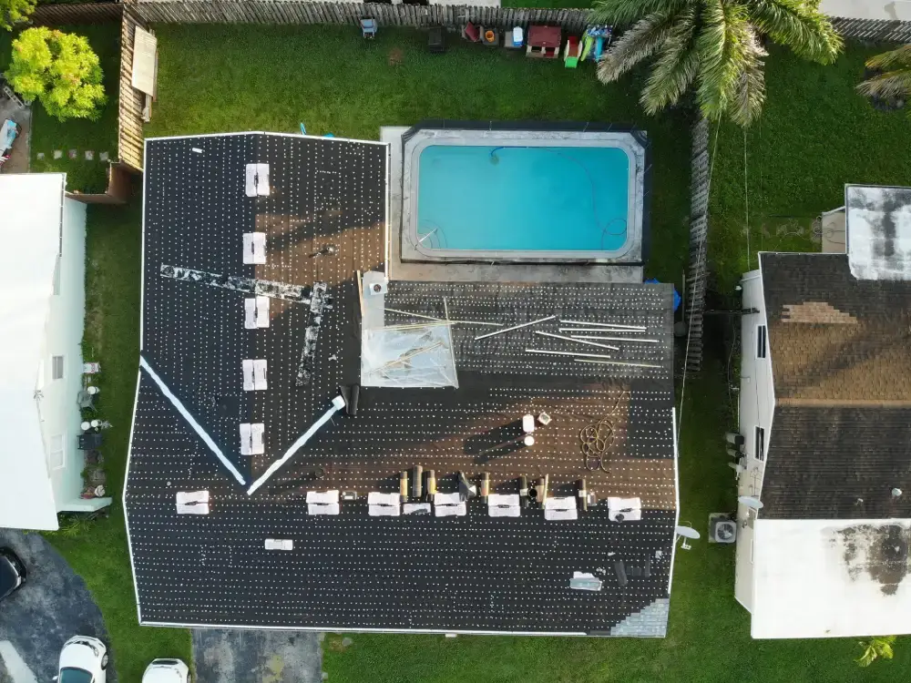 Roof tear-off in progress with new underlayment going down