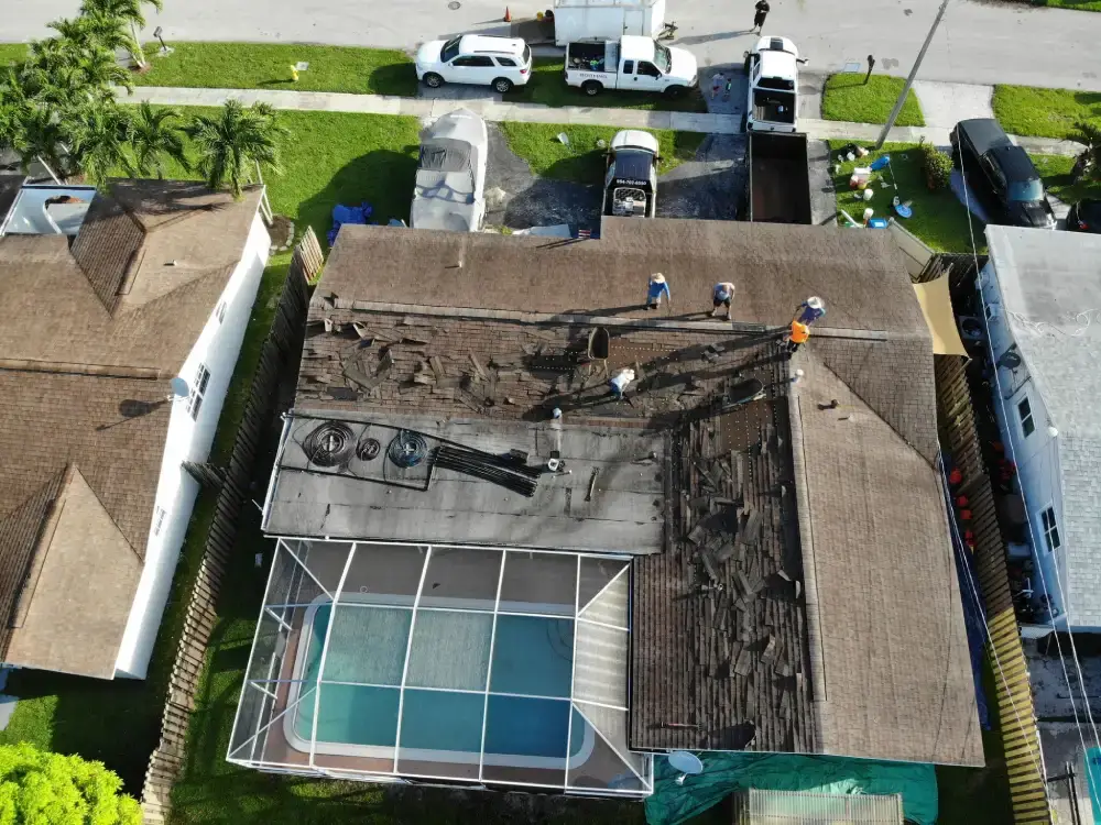 Completed roof replacement over a home with a large screened patio